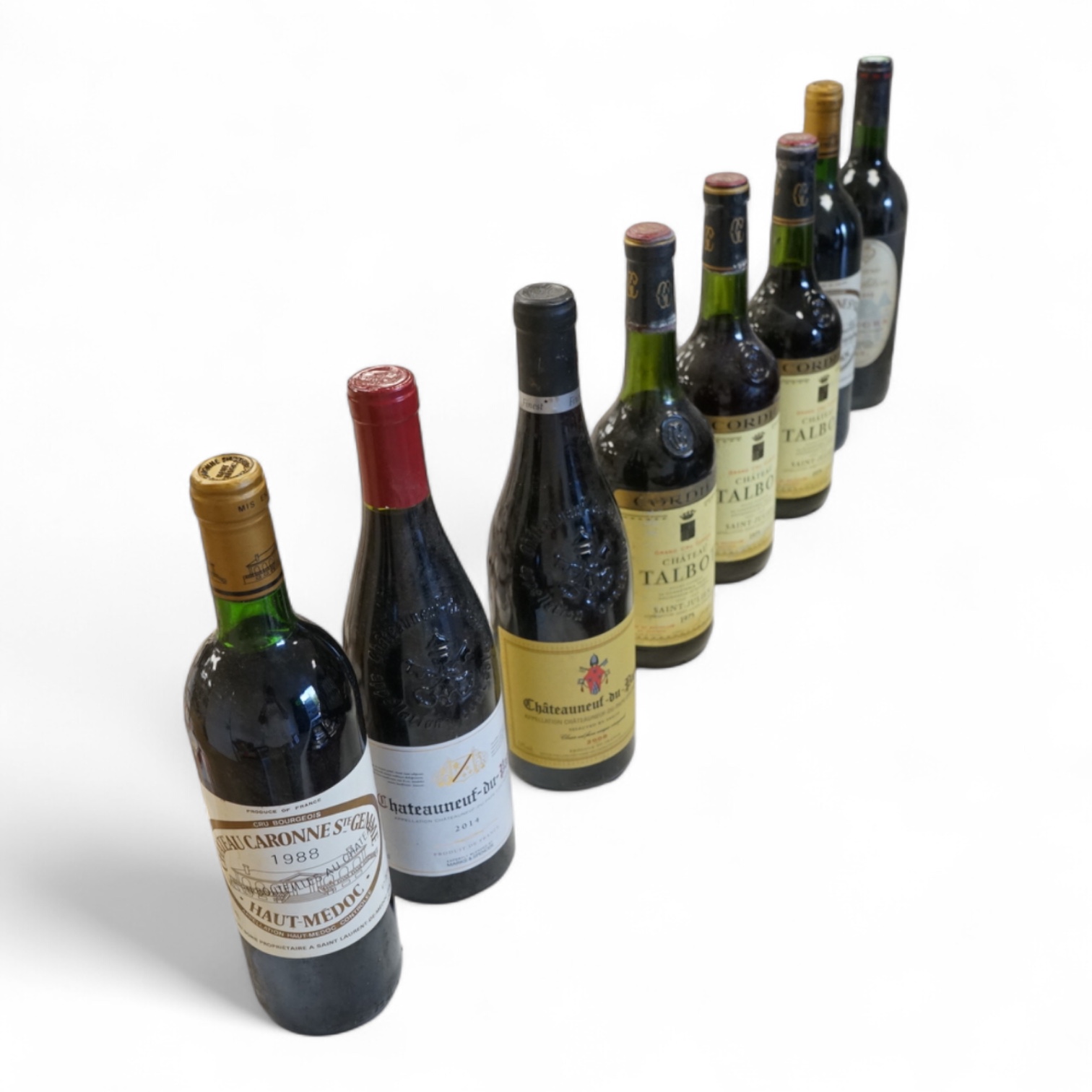 Eight bottles of red wine including three bottles of Chateau Talbot Saint Julien 1975, Chateauneuf du Pape 2008, Chateau Caronne Ste Gemme 1988 etc.